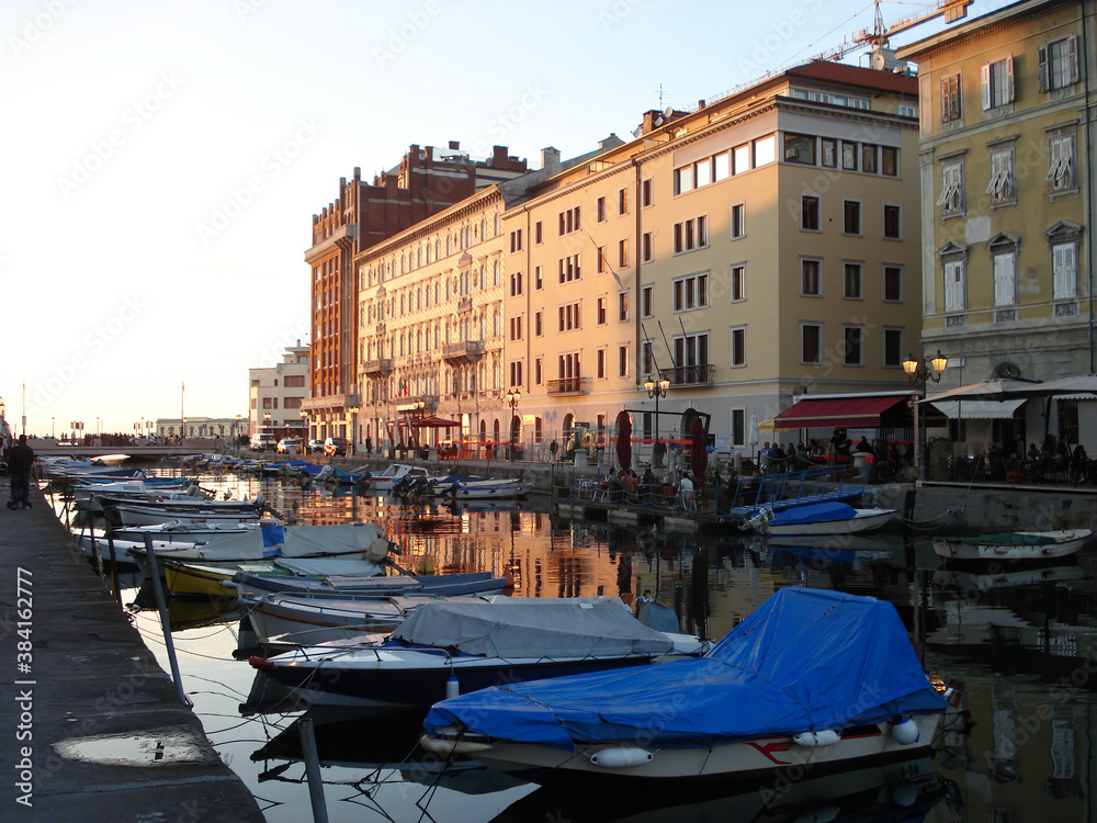 Grand Canal, Canale Grande, with boats and historical buildings. Trieste. Italy