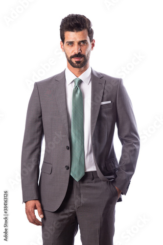A young man wearing a black suit on a white background © Hamdan