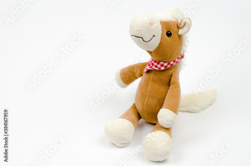 Soft toy horse isolated on white background.