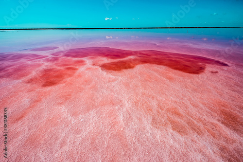 Pink Lake, Ukraine, Europe This lake turns pink in summer cause of an algae with red pigments. Those plants are used for dyeing clothes red