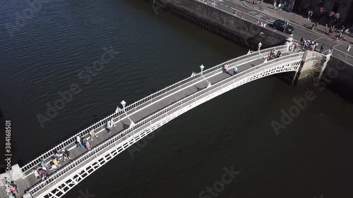 aerial view of city center of Dublin with river Liffey, people crossing the Penny bridge in Dublin photo