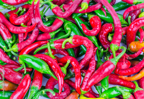 Background from green and red chili peppers. Chili pepper close up.