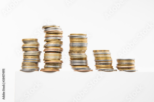 collection of colorful metal coins isolated on white background, close view 