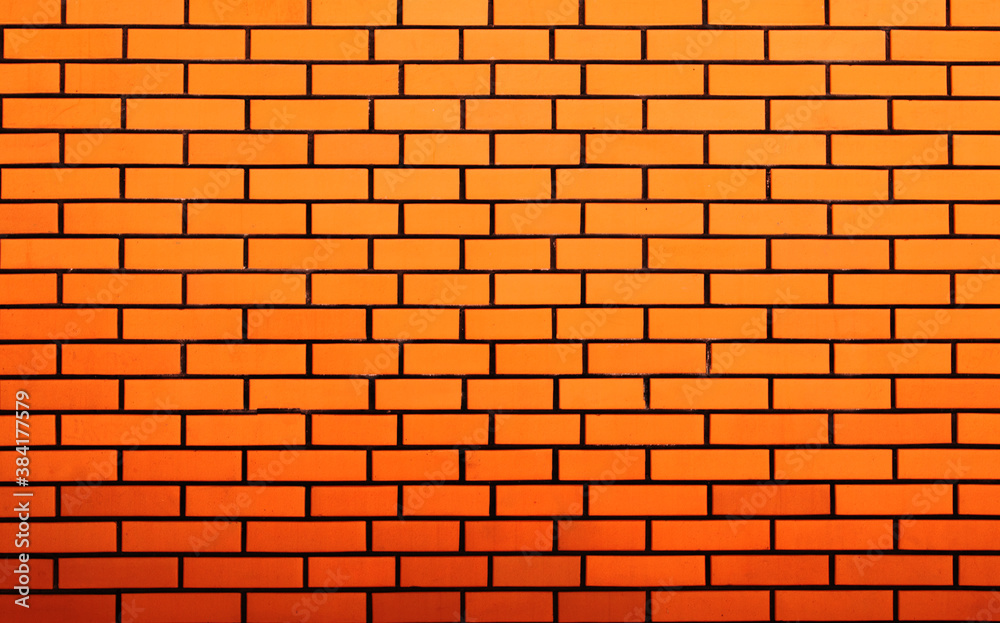 Fototapeta premium Stone wall from orange bricks as a background
