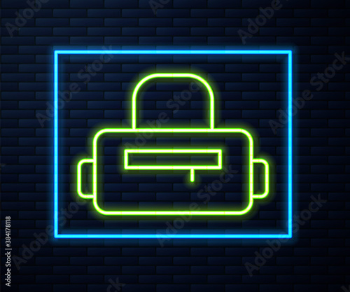 Glowing neon line Sport bag icon isolated on brick wall background. Vector.