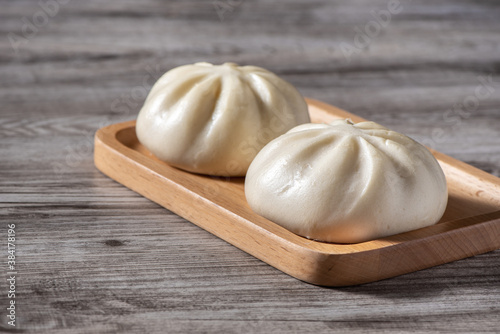 Close up of fresh delicious baozi, Chinese steamed meat bun. photo