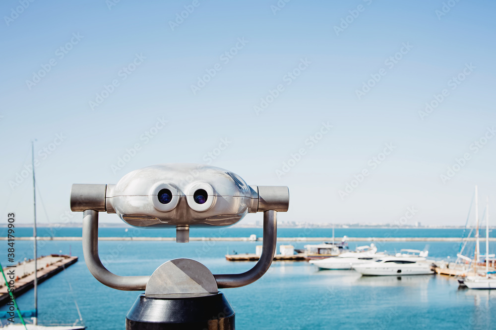 Binoculars looking out on the marina with boats