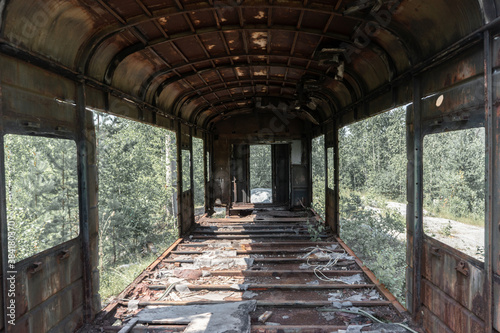 inside an abandoned railway carriage standing in the forest © vetaka