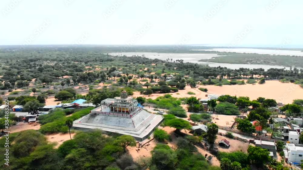 Drone approaching a large Hindu temple in a village in Southern India. Drone approaching a large Hindu temple in a village in Southern India.