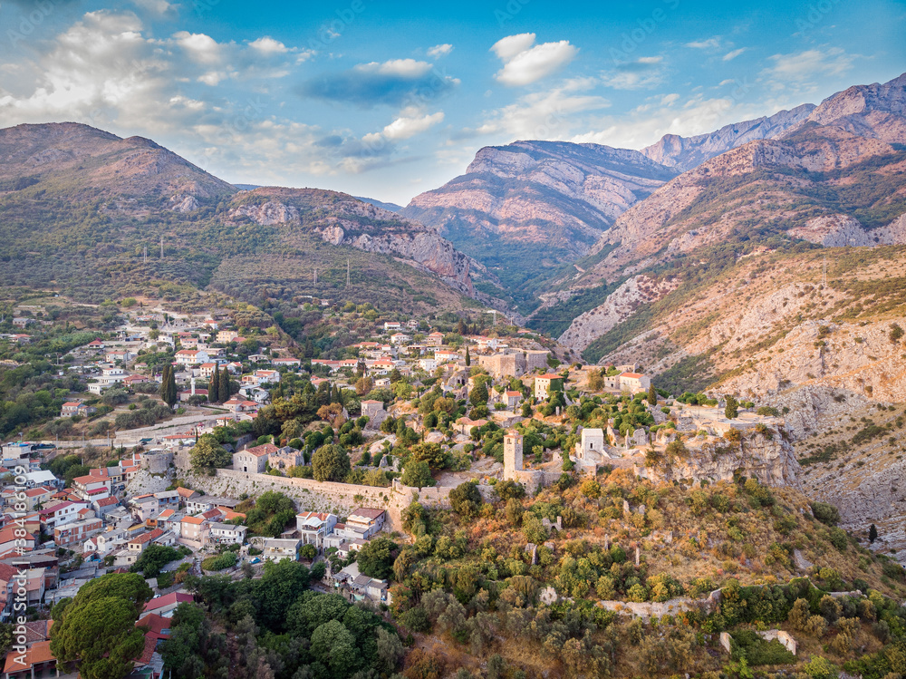 Sunset cityscape panorama of Old Bar town from ancient fortress walls. Bar, Montenegro. Drone aerial shot