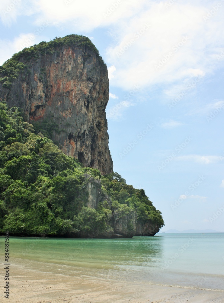 Cliffs rising high above the water at Railay West Beach, Krabi, Thailand
