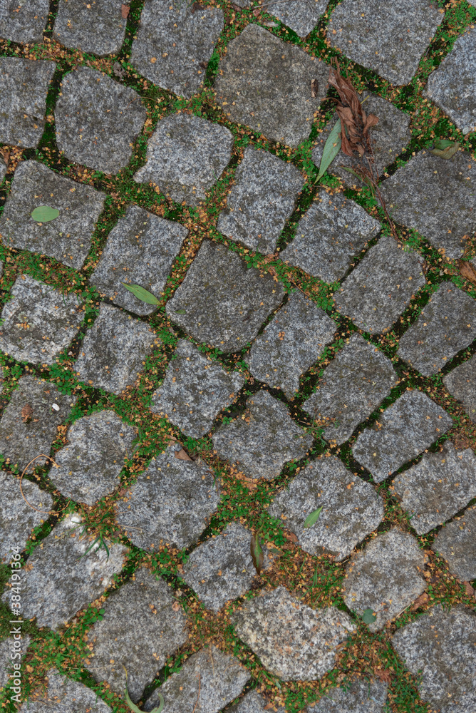 Abstract background of an old cobblestone street close-up. Abstract background of an old cobblestone street close-up.