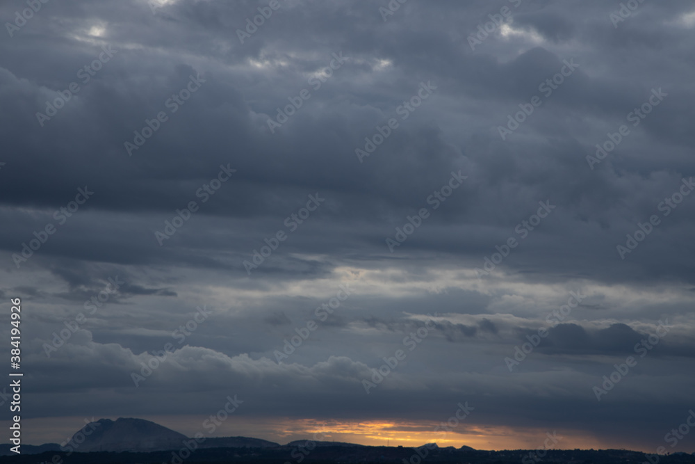 A Panoramic Silhouette of low hills in wide angle view and beautiful clouds formation in the Horizon A Panoramic Silhouette of low hills in wide angle view and beautiful clouds formation in the Horizon