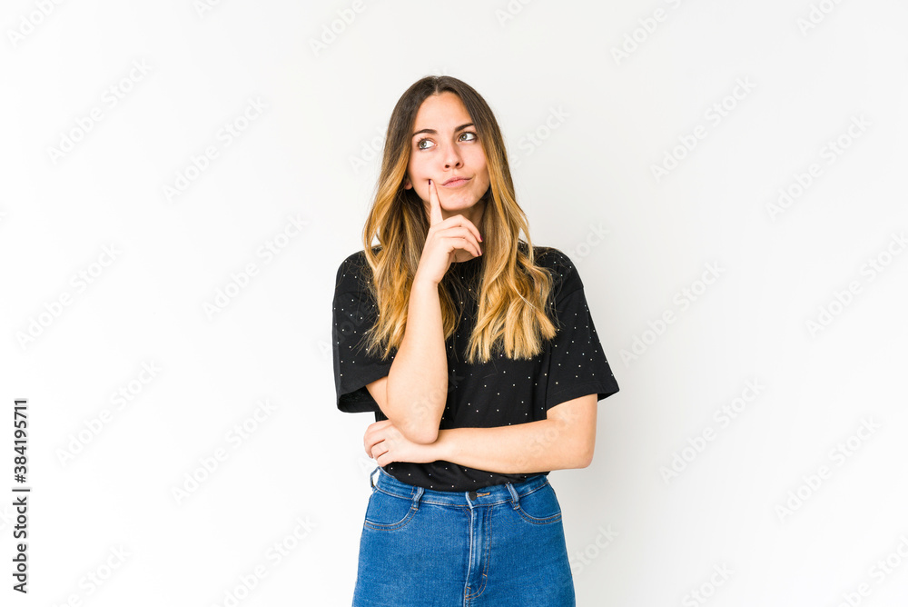 Young caucasian woman isolated on white background contemplating, planning a strategy, thinking about the way of a business.
