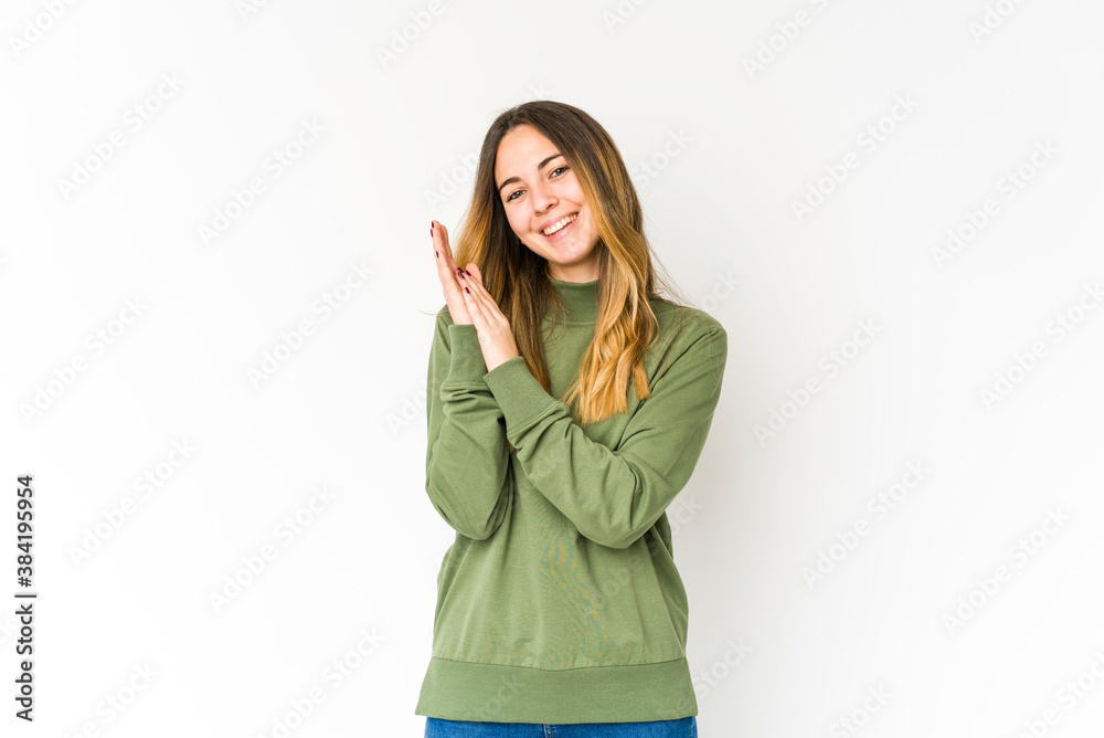 Young caucasian woman isolated on white background feeling energetic and comfortable, rubbing hands confident.