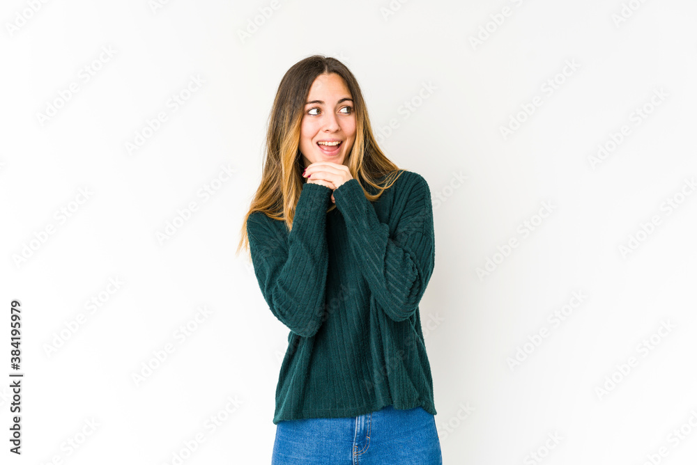Young caucasian woman isolated on white background praying for luck, amazed and opening mouth looking to front. Young caucasian woman isolated on white background praying for luck, amazed and opening mouth looking to front.