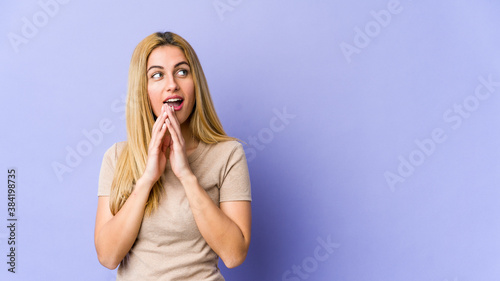 Young blonde caucasian woman making up plan in mind, setting up an idea.