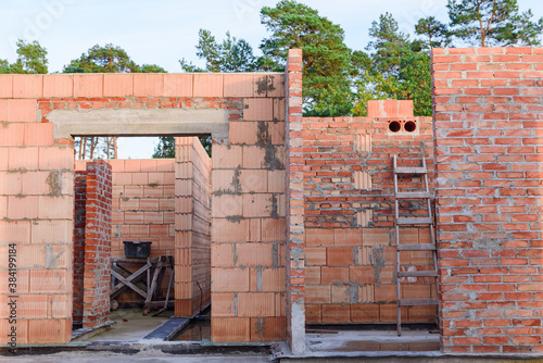 Interior of a Unfinished Red Brick House Walls under Construction without Roofing