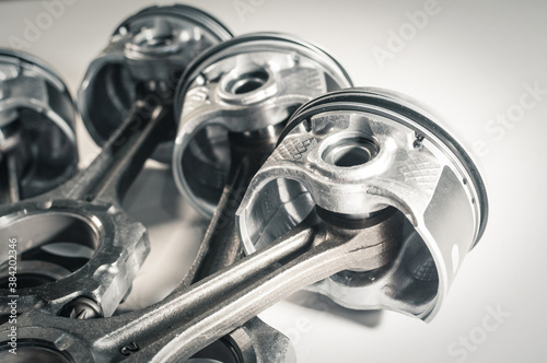 Foto pistons with connecting rod engine car on white background