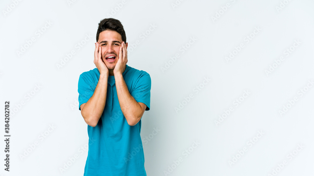 Young caucasian man isolated on white background whining and crying disconsolately. Young caucasian man isolated on white background whining and crying disconsolately.