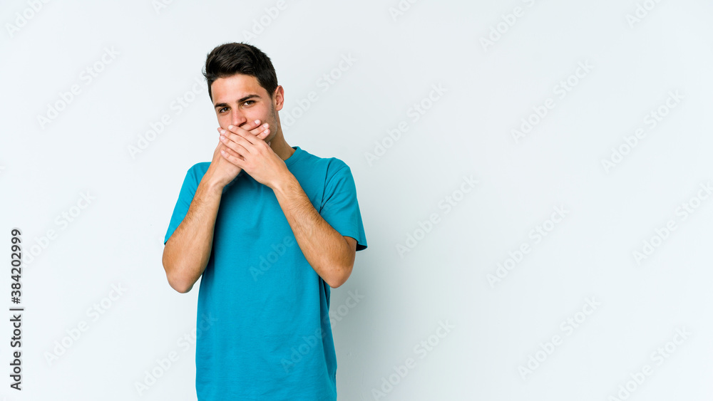 Young caucasian man isolated on white background covering mouth with hands looking worried. Young caucasian man isolated on white background covering mouth with hands looking worried.
