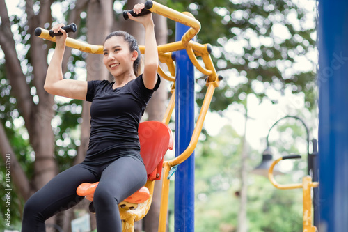 Asian women are exercising at the park.