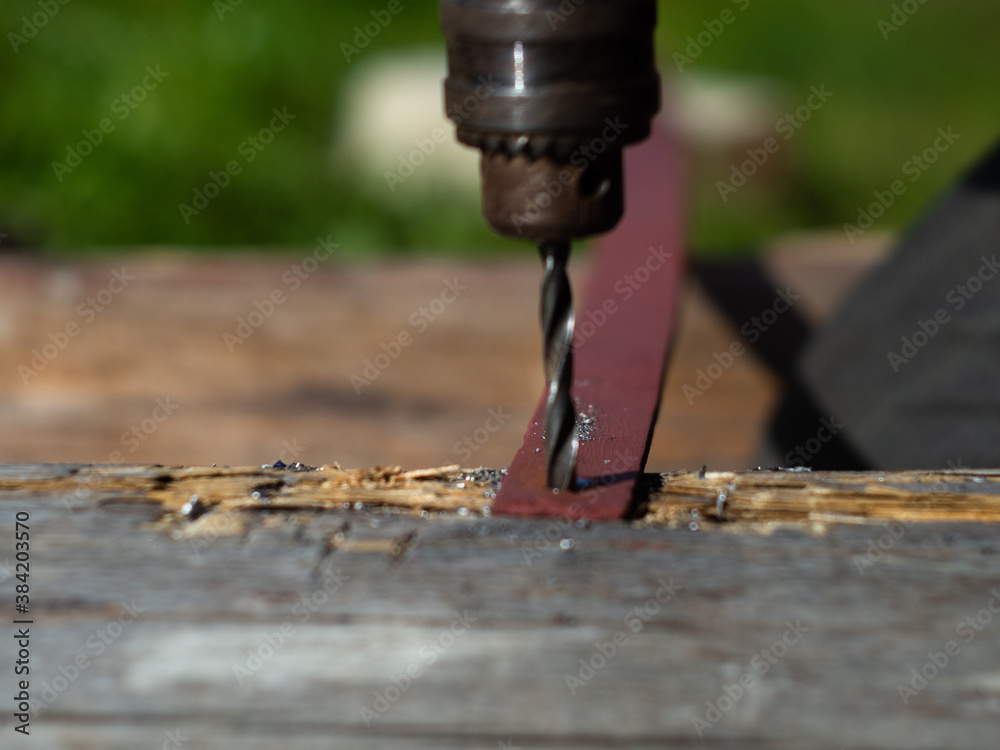 drilling with a metal drill. drill in the cartridge close-up.