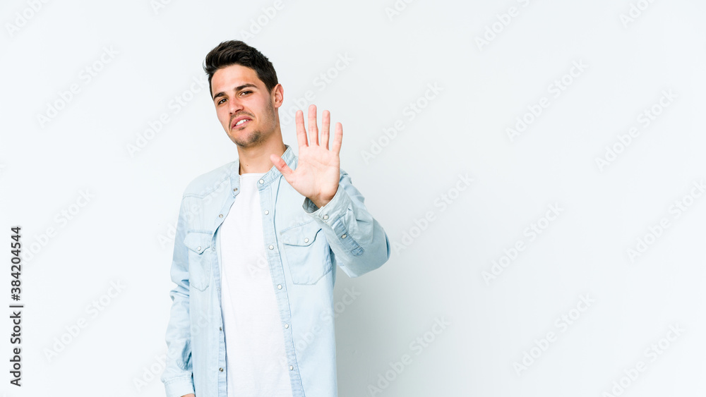 Young caucasian man isolated on white background rejecting someone showing a gesture of disgust. Young caucasian man isolated on white background rejecting someone showing a gesture of disgust.