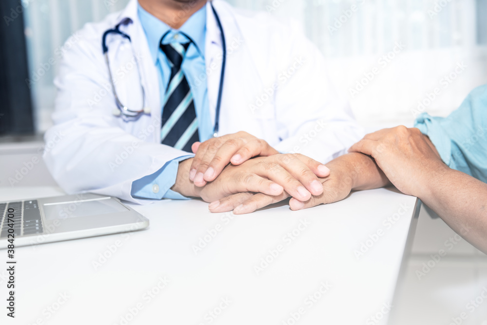 The doctor hold hands patient to encourage To fight the disease And cheer to receive treatment, to health care concept. The doctor hold hands patient to encourage To fight the disease And cheer to receive treatment, to health care concept.
