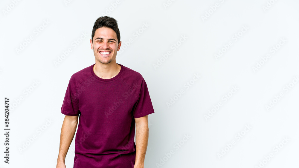 Young caucasian man isolated on white background laughs and closes eyes, feels relaxed and happy. Young caucasian man isolated on white background laughs and closes eyes, feels relaxed and happy.