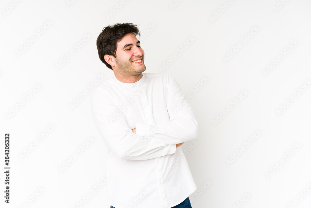 Young man isolated on white background smiling confident with crossed arms. Young man isolated on white background smiling confident with crossed arms.