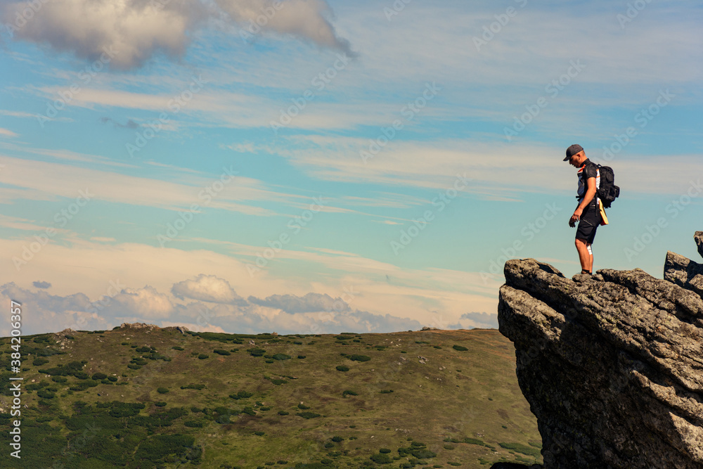 A man on one of the peaks of Carpathian beauties, Carpathian mountains, Montenegrin ridge, Eared Stone mountain.