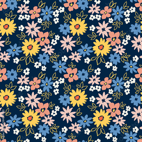 Vintage floral background. Seamless vector pattern for design and fashion prints. Flowers pattern with small colorful flowers on a dark blue background. Ditsy style.