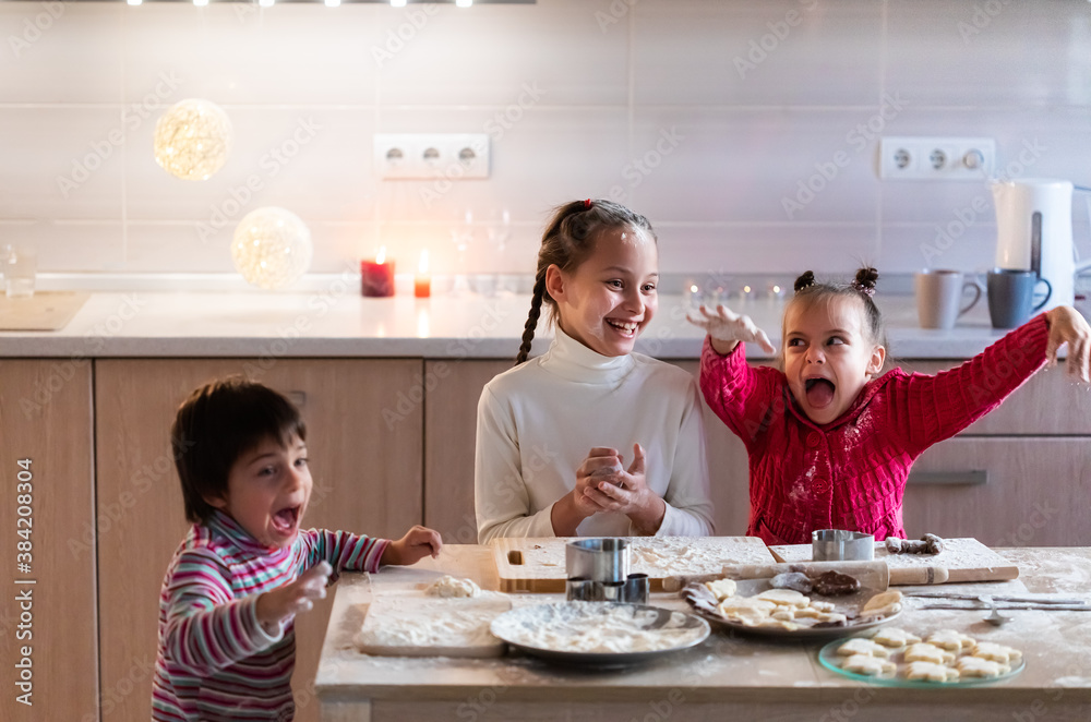 Children preparing cookies and having fun at home Children preparing cookies and having fun at home
