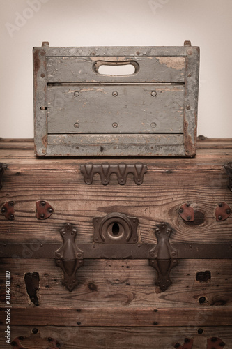 Vintage Milk Crate on Old Wooden Trunk, Room for Text Below