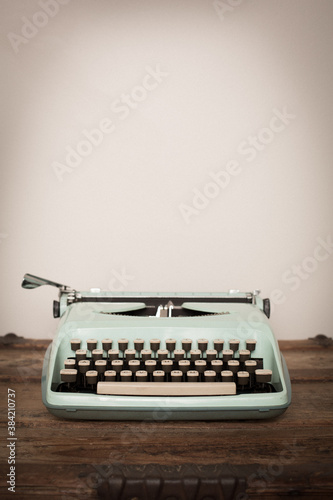 Vintage Typewriter Sitting on Old Wooden Trunk, Room for Text Above