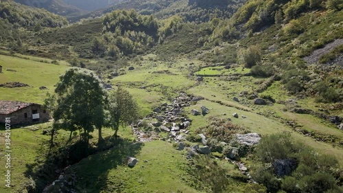 Aerial Backward Stream in a Livestock Valley. Healthy Environment. Trekking Route. Asturias, Spain.	