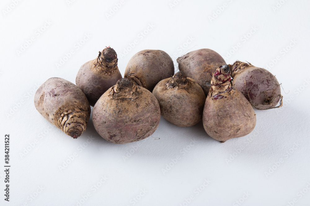 Beet pile with white background. Copy space. Beet pile with white background. Copy space.