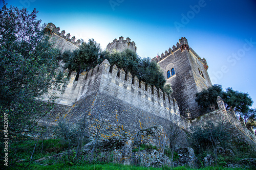 Great fortress wall with square and circular tower, view from base Fototapeta