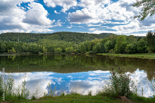 Lake with Forest and Cloudy Sky 