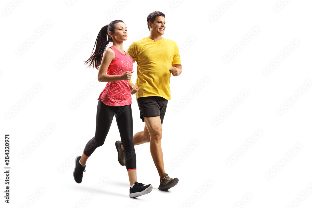 Full length shot of a young man and woman in sportswear jogging Full length shot of a young man and woman in sportswear jogging
