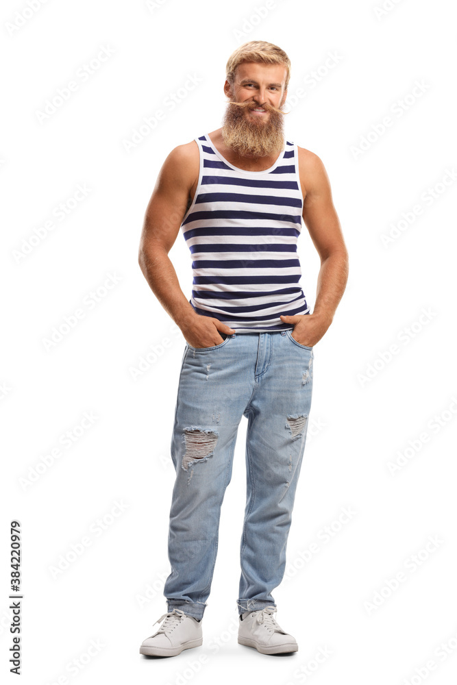 Full length portrait of a blond bearded guy wearing a striped vest and jeans Full length portrait of a blond bearded guy wearing a striped vest and jeans