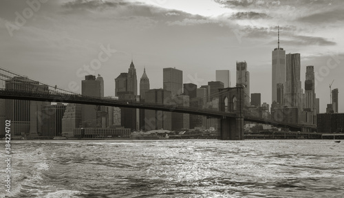 Black and white photo of New York City skyline with a view of the Brooklyn Bridge