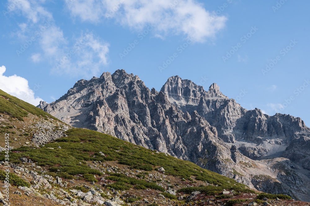 Avusor rocky mountains peak against blue sky