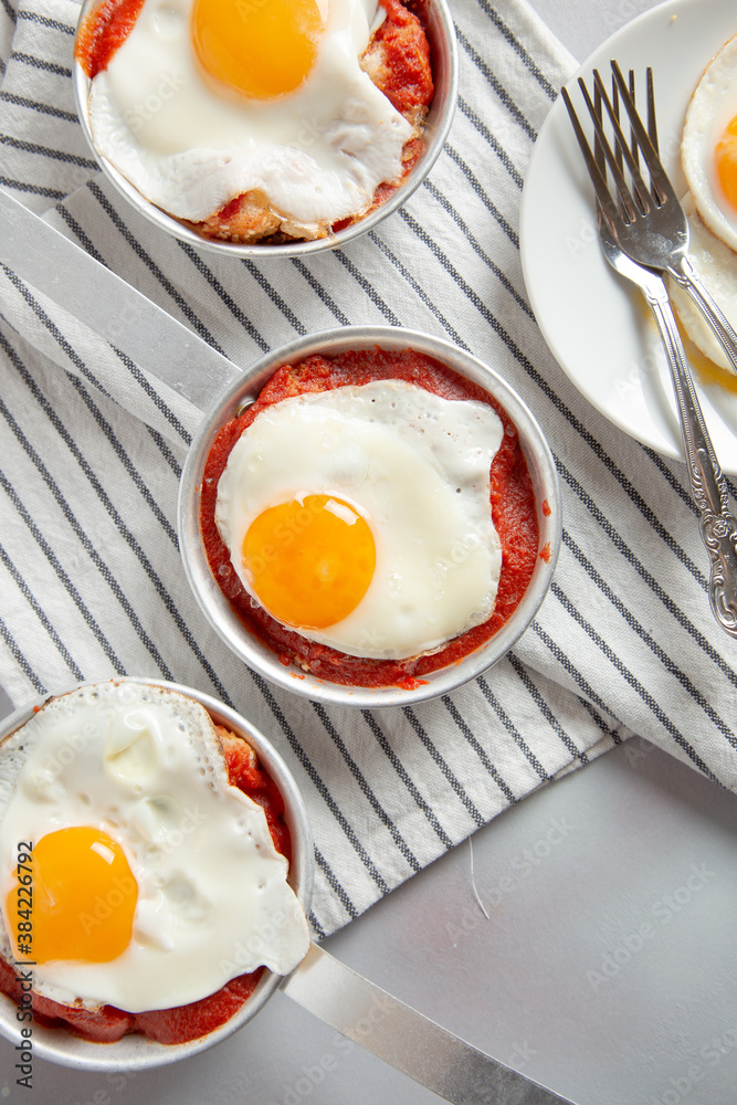 fried egg on a white plate fried egg on a white plate
