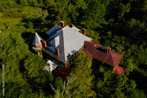 These are aerial photos of the abandoned Dunnington Mansion in Farmville, Virginia. The mammoth house features Italianate architecture and a greenhouse. photo