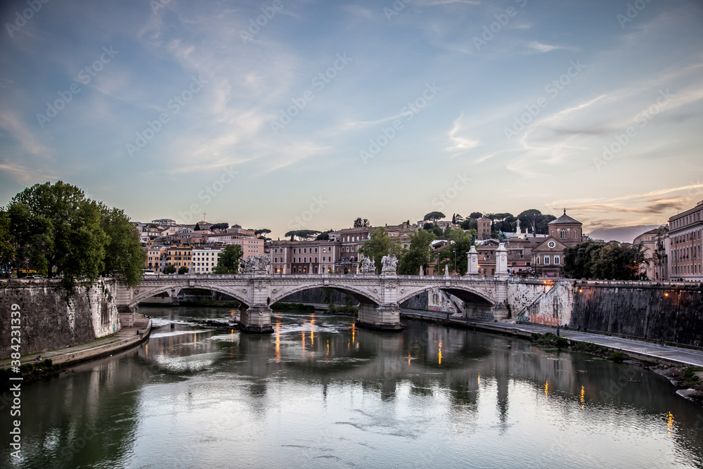 Naklejka premium View of the Victor Emmanuel bridge and St. Peter's Cathedral in the early evening. Rome, Lazio, Italy
