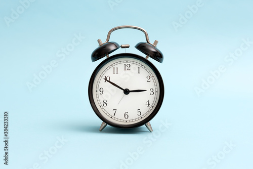 Analog clock on blue background