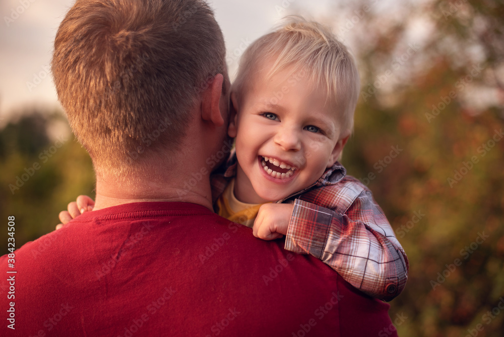 Father piggyback his little son outside Father piggyback his little son outside