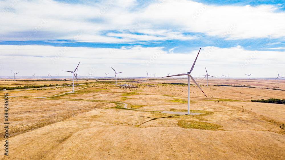  top view of modern windmills standing in the middle of the desert